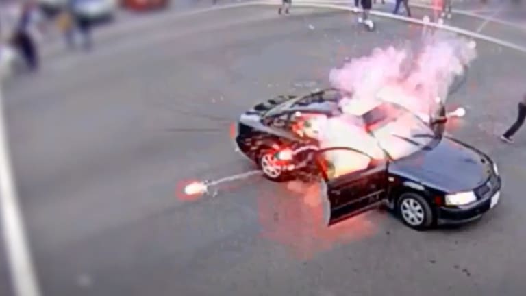 Driver Ignites Firework At BLM Protest, Protester Tosses It Back Into His Car